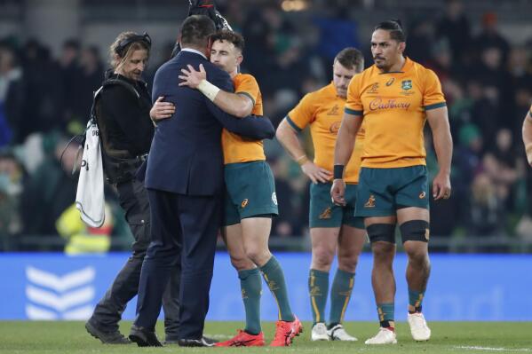 Australia's rugby coach Dave Rennie consoles Nic White following the rugby union international between Ireland and Australia at the Aviva Stadium in Dublin, Ireland, Saturday, Nov. 19, 2022. (AP Photo/Peter Morrison)