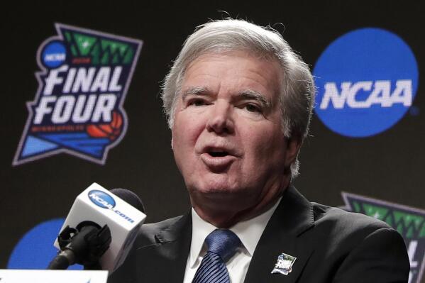 FILE - In this April 4, 2019, file photo, NCAA President Mark Emmert answers questions at a news conference at the Final Four college basketball tournament in Minneapolis. Emmert told the organization's more than 1,200 member schools Friday, June 18, 2021, that he will seek temporary rules as early as July to ensure all athletes can be compensated for their celebrity with a host of state laws looming and congressional efforts seemingly stalled.  (AP Photo/Matt York, File)