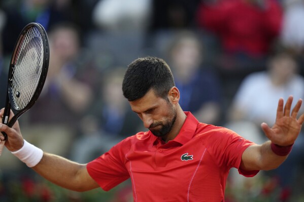 Serbia's Novak Djokovic reacts during a match against France's Corentin Moutet at the Italian Open tennis tournament in Rome, Friday, May 10, 2024. (AP Photo/Alessandra Tarantino)