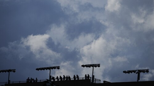 Fans wait for a NASCAR Cup Series auto race at Atlanta Motor Speedway to begin on Sunday, July 9, 2023, in Hampton, Ga. (AP Photo/Brynn Anderson)