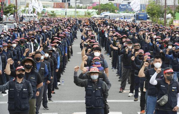 Members of the Cargo Truckers Solidarity stage a rally in Ulsan, South Korea, Monday, June 13, 2022. A weeklong strike by thousands of truckers in South Korea has triggered major disruptions in cargo transport and production that have caused 1.6 trillion won ($1.2 billion) in damages, officials said Monday. (Bae Byung-soo/Newsis via AP)