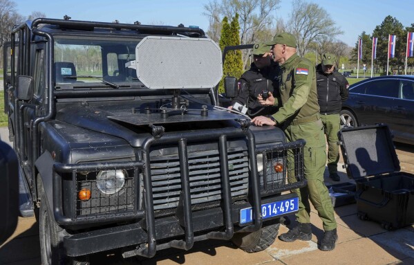 In this photo provided by the Serbian Interior Ministry, Serbian Gendarmerie officers show the U.S.-made Long Range Acoustic Device (LRAD) – which is illegal in Serbia and many other countries, in Belgrade, Serbia, Wednesday, March 19, 2025. (Serbian Ministry of Interior via AP)