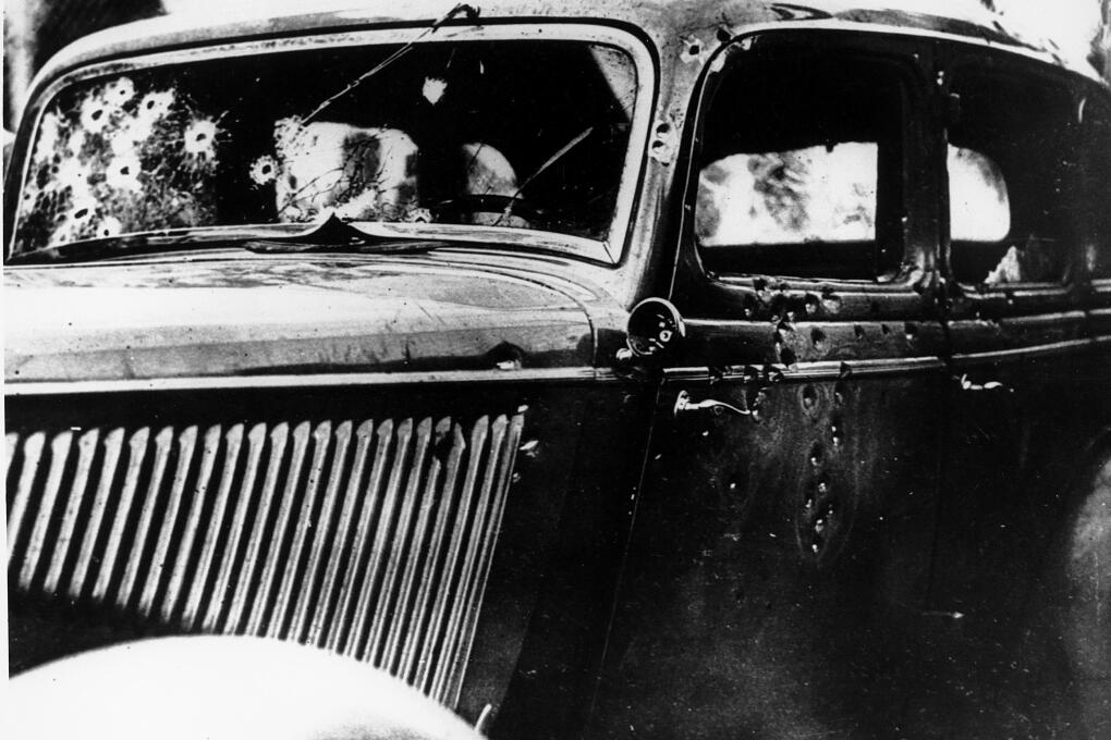 The bullet-riddled automobile in which the bandits, Clyde Barrow and Bonnie Parker, were trapped, shot and killed on a Louisiana road is seen May 24, 1934.  Officers waited for the desperados near Arcadia, La., and pumped 167 bullets into the car.  (AP Photo)