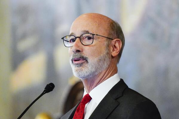 Democratic Gov. Tom Wolf delivers his budget address for the 2022-23 fiscal year to a joint session of the Pennsylvania House and Senate in Harrisburg, Pa., Tuesday, Feb. 8, 2022. (AP Photo/Matt Rourke)