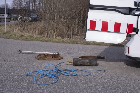 Aarhus Water works at the sewer where the body of a man was found on Sunday, March 2, 2025. (Bo Amstrup/Scanpix via AP, file)