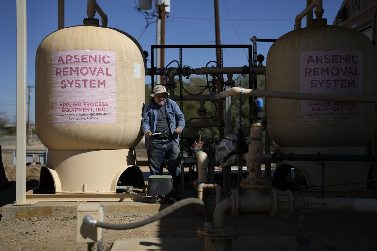 Water operator Robert Tipton checks flow rates of a well at the Wenden Domestic Water Improvement District's offices Tuesday, Oct. 17, 2023, in Wenden, Ariz. (AP Photo/John Locher)