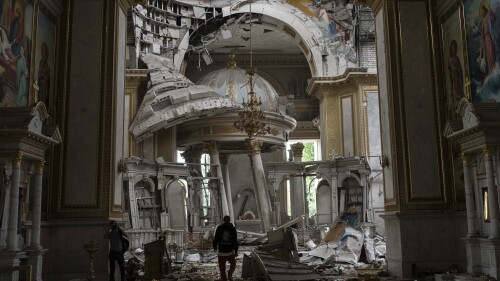 Church personnel inspect damages inside the Odesa Transfiguration Cathedral in Odesa, Ukraine, Sunday, July 23, 2023, following Russian missile attacks. (AP Photo/Jae C. Hong)