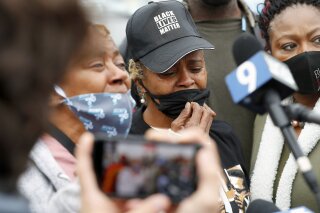 Sherrellis Sheria Stinnette, grandmother of Marcellis Stinnette, 19, speaks to the media during a protest rally for Marcellis Stinnette who was killed by Waukegan Police last Tuesday in Waukegan, Ill., Thursday, Oct. 22, 2020. Stinnette was killed and his girlfriend and mother of his child, Tafara Williams, was wounded when a police officer in Waukegan opened fire Tuesday night after police said Williams' vehicle started rolling toward the officer following a traffic stop. (Brian Hill/Daily Herald via AP)