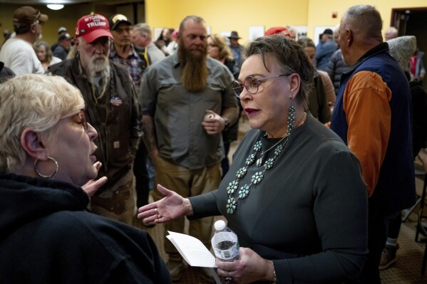 Rep. Harriet Hageman, R-Wyo., talks to attendees after holding a town hall meeting, March 14, 2025, in Evanston, Wyo. (AP Photo/Spenser Heaps, File)
