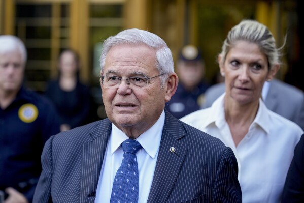 Sen. Bob Menendez and his wife, Nadine Menendez, leave federal court, Wednesday, Sept. 27, 2023, in New York. Menendez pled not guilty to federal charges alleging he used his powerful post to secretly advance Egyptian interests and carry out favors for local businessmen in exchange for bribes of cash and gold bars. (AP Photo/Seth Wenig)