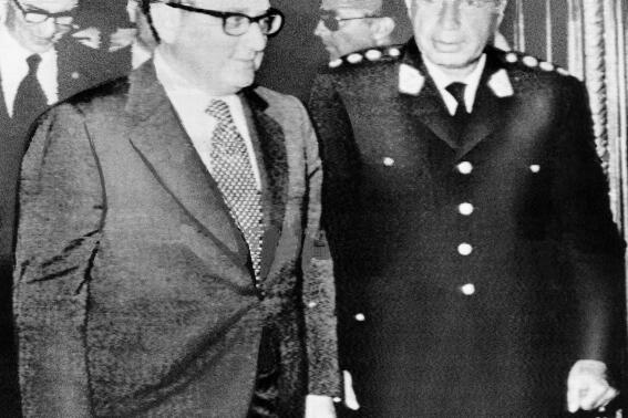 FILE - Peru's President Francisco Morales Bermudez, right, meets with U.S. Secretary of State Henry A. Kissinger in Lima, Peru, Feb. 18, 1976, during Kissinger's Latin American tour. Morales Bermudez, a former Peruvian military president (1975-1980), died in Lima, Peru at the age of 100 on July 14, 2022, according to his son. (AP Photo, File)