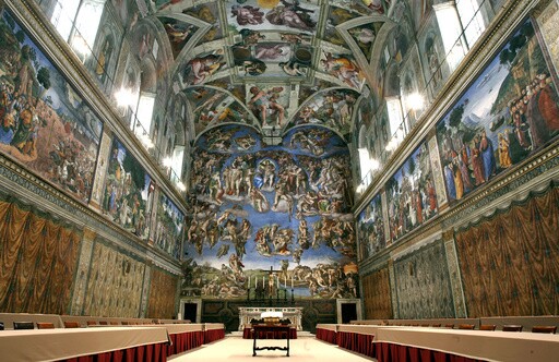 Tables and chairs line the Sistine Chapel at the Vatican in preparation for the conclave, on April 16, 2005. (AP Photo/Pier Paolo Cito, File)