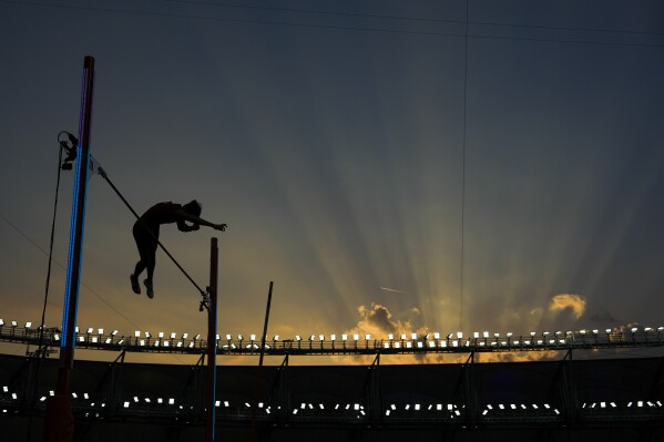 Bokai Huang, of China, competes in the Men's pole vault final during the World Athletics Championships in Budapest, Hungary, Saturday, Aug. 26, 2023. (AP Photo/Ashley Landis)