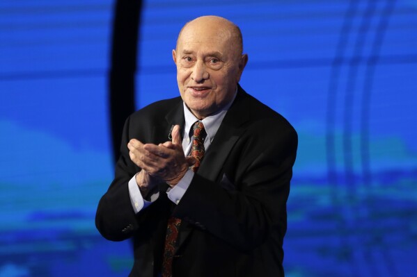 FILE -- Italian sculptor Arnaldo Pomodoro attends the Italian State RAI TV program "Che Tempo che Fa", in Milan, Italy, Sunday, Dec. 18, 2016. (AP Photo/Antonio Calanni)
