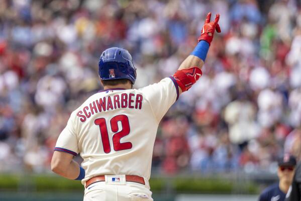 Philadelphia Phillies designated hitter Kyle Schwarber gestures after hitting a home run during the seventh inning of a baseball game against the Boston Red Sox, Sunday, May 7, 2023, in Philadelphia. (AP Photo/Laurence Kesterson)