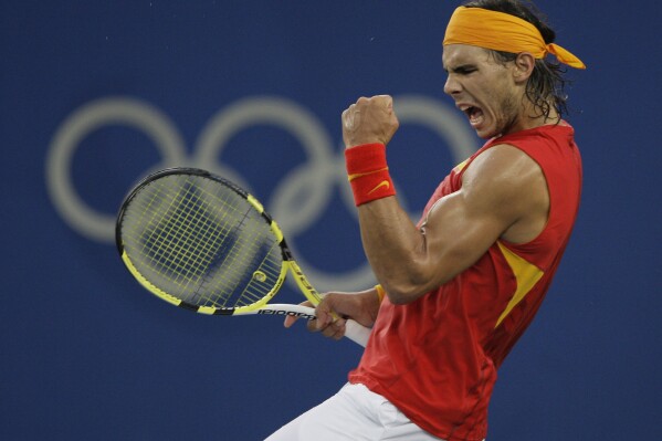 FILE - Rafael Nadal of Spain reacts to winning a point against Fernando Gonzalez of Chile during their Gold medal singles tennis match at the Beijing 2008 Olympics in Beijing, Sunday, Aug. 17, 2008. (AP Photo/Elise Amendola, File)
