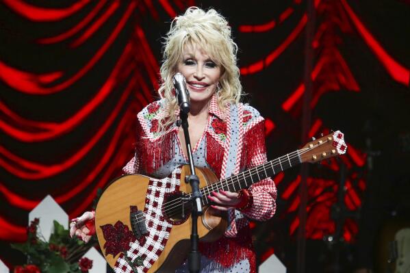 FILE - Dolly Parton performs at Austin City Limits Live during Blockchain Creative Labs' Dollyverse event during the South by Southwest Music Festival on March 18, 2022, in Austin, Texas. Parton is donating $1 million to pediatric infectious disease research at Vanderbilt University Medical Center in Nashville, the organization announced on Wednesday, June 15, 2022. The new gift is one of several Parton has made to the center over the years, including a $1 million gift in April 2020 for COVID vaccine research. (Photo by Jack Plunkett/Invision/AP, File)