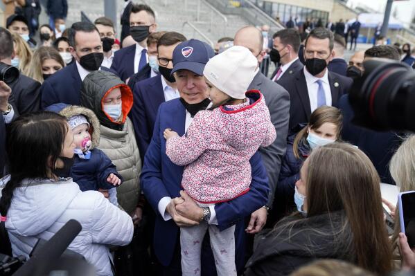 President Joe Biden meets with Ukrainian refugees and humanitarian aid workers during a visit to PGE Narodowy Stadium, Saturday, March 26, 2022, in Warsaw. (AP Photo/Evan Vucci)