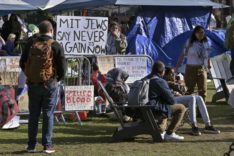 Demonstrators gather by the entrance to a Pro-Palestinian encampment at MIT, Thursday, May 9, 2024, in Cambridge, Mass. (AP Photo/Josh Reynolds)