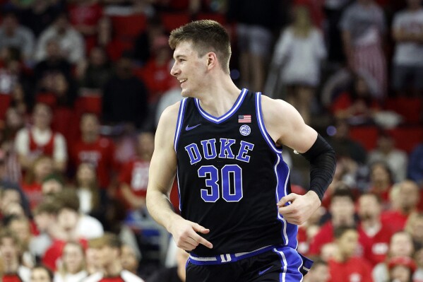 Duke's Kyle Filipowski comes downcourt after scoring during the second half of an NCAA college basketball game against North Carolina State in Raleigh, N.C., Monday, March 4, 2024. (AP Photo/Karl B DeBlaker)