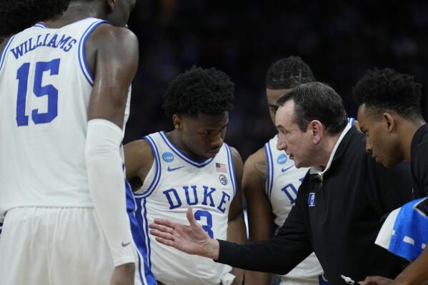 Duke head coach Mike Krzyzewski, second from right, huddles with players during the second half of a college basketball game against Arkansas in the Elite 8 round of the NCAA men's tournament in San Francisco, Saturday, March 26, 2022. (AP Photo/Tony Avelar)