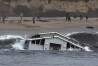 A building from a wharf collapse floats in the ocean Monday, Dec. 23, 2024, in Santa Cruz, Calif. (Shmuel Thaler/The Santa Cruz Sentinel via AP)