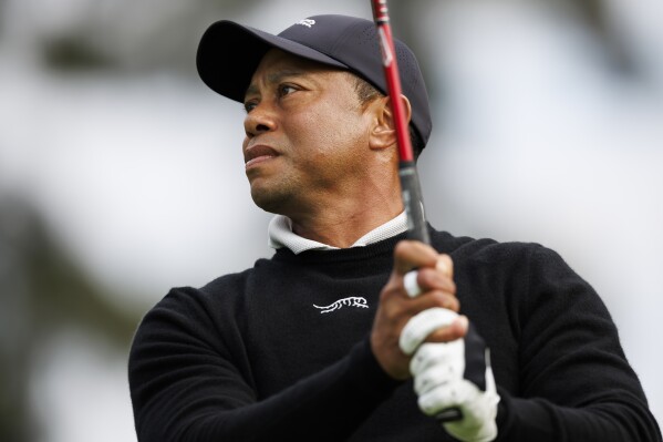 Tiger Woods tees off on the second hole during the Genesis Invitational pro-am golf event at Riviera Country Club, Wednesday, Feb. 14, 2024, in the Pacific Palisades area of Los Angeles. (AP Photo/Ryan Kang)