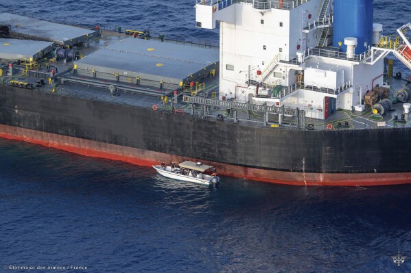 In this undated photo provided by the Etat Major des Armees on Thursday, May 30, 2024, a view of the Laax, a Greek-owned, Marshall Islands-flagged bulk carrier that came under attack by Yemen's Houthi rebels earlier this week, carrying cargo of grain bound for Iran, the group's main benefactor, authorities said Thursday. (Etat Major des Armees via AP)