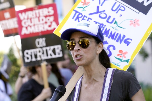 Sarah Silverman walks on a picket line outside Netflix studios on Wednesday, July 26, 2023, in Los Angeles. The actors strike comes more than two months after screenwriters began striking in their bid to get better pay and working conditions. (AP Photo/Chris Pizzello)