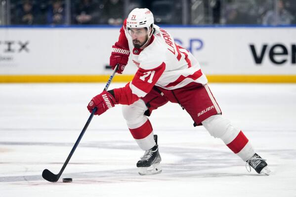 FILE - Detroit Red Wings' Dylan Larkin (71) looks to pass during the first period of an NHL hockey game against the New York Islanders Friday, Jan. 27, 2023, in Elmont, N.Y. The Red Wings have signed Larkin to an eight-year contract worth nearly $70 million, banking on their captain being a key player in the next phase of their rebuilding plan, the team announced Wednesday, March 1, 2023. (AP Photo/Frank Franklin II, File)