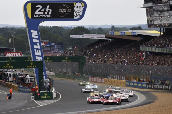 Cars race during the 24-hour Le Mans endurance race, in Le Mans, western France, Saturday, June 10, 2023. (AP Photo/Jeremias Gonzalez)