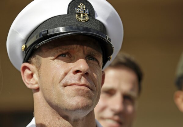 FILE - In this July 2, 2019, file photo, Navy Special Operations Chief Edward Gallagher leaves a military court on Naval Base San Diego. The secretary of the U.S. Navy said Saturday, Nov. 23, he doesn't consider a tweet by President Donald Trump an order and would need a formal order to stop a review of Gallagher, who could lose his status as a Navy Seal. (AP Photo/Gregory Bull, File)