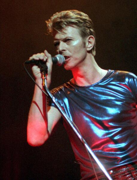FILE - David Bowie performs during a concert in Hartford, Conn., on Sept. 14, 1995. The extensive catalog of David Bowie, stretching from the late 1960s to just before his death in 2016, has been sold to Warner Chappell Music. More than 400 songs, among them “Space Oddity,” “Ziggy Stardust," and “Let’s Dance" are included. (AP Photo/Bob Child, File)