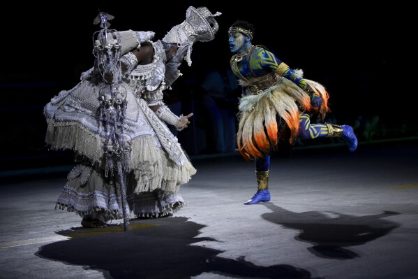 Performers from the Unidos da Tijuca samba school dance during Carnival celebrations at the Sambadrome in Rio de Janeiro, Monday, March 3, 2025. (AP Photo/Bruna Prado)