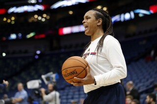 FILE - New Orleans Pelicans player development coach Teresa Weatherspoon stands on the court before the team's preseason NBA basketball game against the Utah Jazz in New Orleans, Oct. 11, 2019. The Chicago Sky have an agreement in place with Weatherspoon to make her their next coach, according to her agent Richard Gray. He confirmed the news in a text message with The Associated Press on Tuesday night, Oct. 10, 2023. (AP Photo/Tyler Kaufman, File)