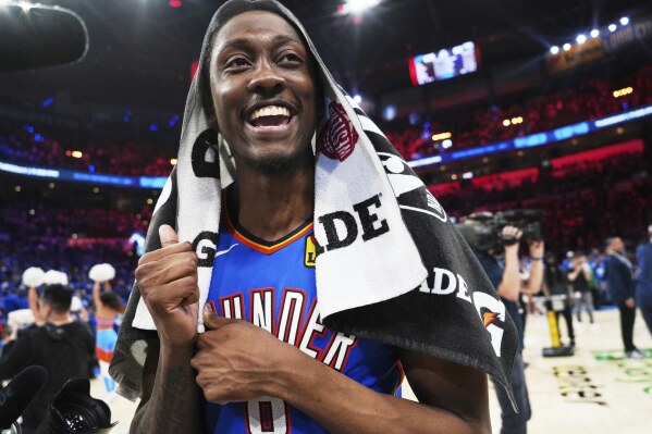 Oklahoma City Thunder's Jalen Williams celebrates as he walks off the court after the team's win against the Denver Nuggets in Game 7 in the Western Conference semifinals of the NBA basketball playoffs, Sunday, May 18, 2025, in Oklahoma City. (AP Photo/Kyle Phillips)
