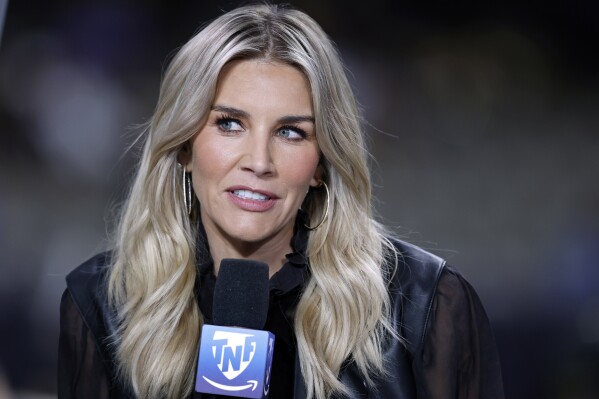 FILE - Amazon Prime Thursday Night Football commentator Charissa Thompson speaks before an NFL football game between the New Orleans Saints and the Jacksonville Jaguars, Oct. 19, 2023, in New Orleans. Fox Sports and Amazon host Thompson took to social media on Friday, Nov. 17, to clarify remarks she had made on a podcast earlier this week when she said 鈥渟he made up鈥� sideline reports on NFL games. Thompson, who hosts Fox's NFL Kickoff Sunday show and Amazon Prime Video's 鈥淭hursday Night Football鈥� coverage, said in a post Friday that she did not make up quotes from players or coaches, and that what she would report were her observations on the sidelines. (AP Photo/Tyler Kaufman, File)