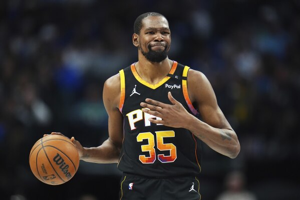 Phoenix Suns forward Kevin Durant gestures during the second half of an NBA basketball game on March 9, 2025, in Dallas. (AP Photo/Julio Cortez, File)