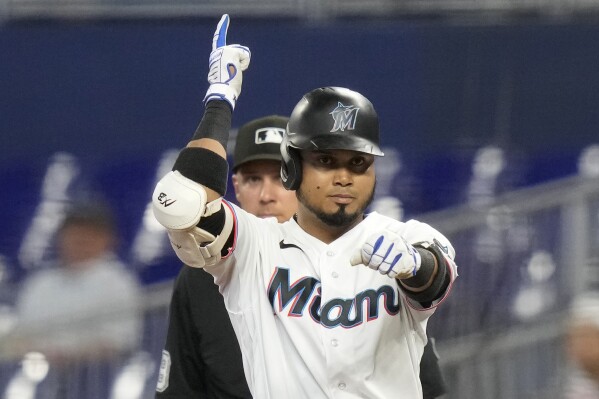Miami Marlins' Luis Arraez reacts after hitting a single during the third inning of a baseball game against the Toronto Blue Jays, Wednesday, June 21, 2023, in Miami. (AP Photo/Lynne Sladky)
