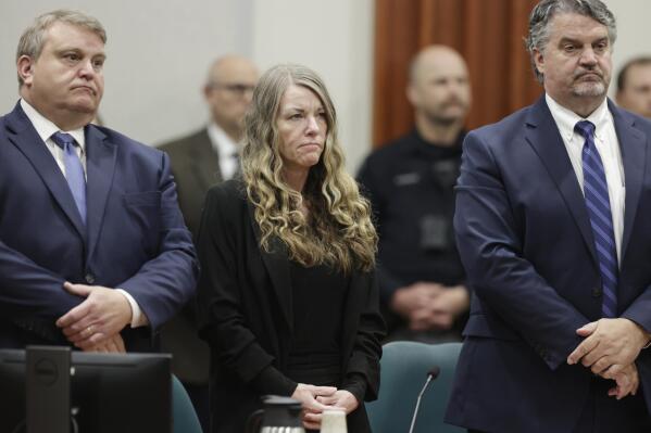 Lori Vallow Daybell stands and listens as the jury's verdict is read at the Ada County Courthouse in Boise, Idaho on Friday May 12, 2023. The Idaho jury convicted Daybell of murder in the deaths of her two youngest children and a romantic rival, a verdict that marks the end of a three-year investigation that included bizarre claims of zombie children, apocalyptic prophesies and illicit affairs.(AP Photo/Kyle Green)