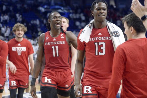 Rutgers' Clifford Omoruyi (11) and Antwone Woolfolk (13) come off the court after defeating Penn State in an NCAA college basketball game, Sunday, Feb. 26, 2023, in State College, Pa. (AP Photo/Gary M. Baranec)