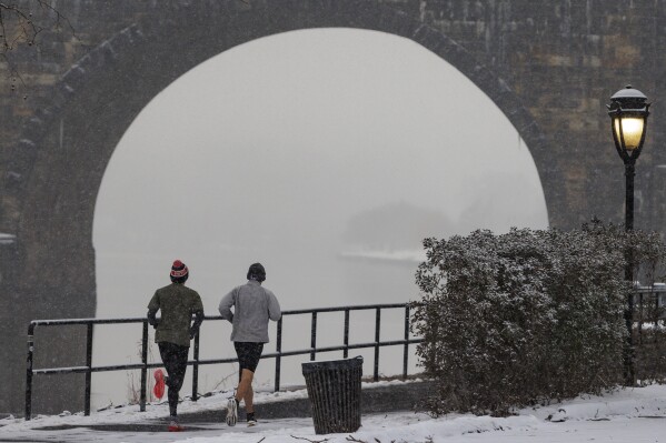 FILE - Joggers run along Kelly Drive in Philadelphia on Jan. 19, 2024. For the eighth straight month, Earth was record hot, according to the European climate agency’s analysis of January 2024. (Alejandro A. Alvarez/The Philadelphia Inquirer via AP, File)