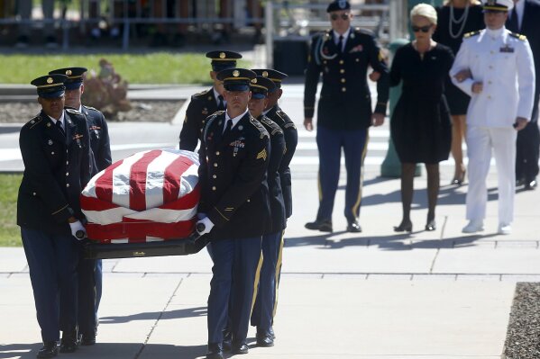 
              Cindy McCain, wife of Sen. John McCain, R-Ariz. arrives with her sons Jack, right, and Jimmy for a memorial service at the Arizona Capitol on Wednesday, Aug. 29, 2018, in Phoenix, (AP Photo/Ross D. Franklin, Pool)
            