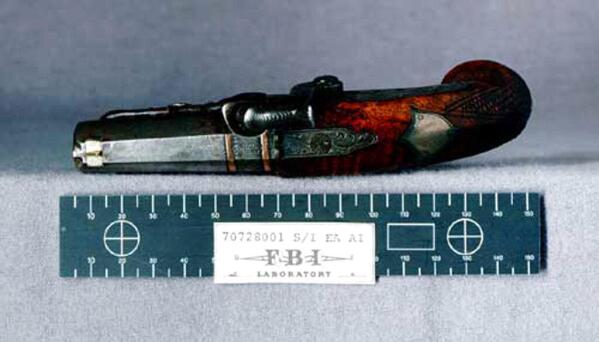 This is the Deringer pistol that was recovered from the state box at the Ford Theater and used by John Wilkes Booth to assassinate President Abraham Lincoln in 1865.  (AP Photo/FBI)