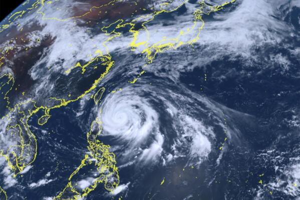 This satellite image released by National Institute of Information and Communications Technology (NICT), shows Typhoon Mawar approaching Philippine northern provinces Monday, May 29, 2023. (National Institute of Information and Communications Technology via AP)