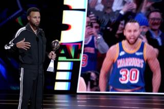 NBA player Stephen Curry, of the Golden State Warriors, accepts the award for best record-breaking performance for passing Ray Allen for most 3-pointers made in NBA history at the ESPY Awards on Wednesday, July 20, 2022, at the Dolby Theatre in Los Angeles. (AP Photo/Mark Terrill)