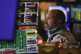 FILE - Traders work on the floor at the New York Stock Exchange in New York, Tuesday, Oct. 4, 2022. If the economy really is headed for a recession, the stock market may have still more to drop. (AP Photo/Seth Wenig, File)