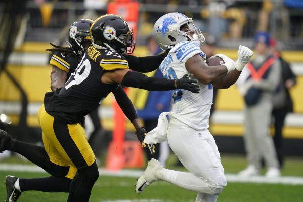 Detroit Lions running back Jermar Jefferson (28) heads for the end zone with Pittsburgh Steelers free safety Minkah Fitzpatrick (39) and Pittsburgh Steelers safety Terrell Edmunds (34) in pursuit during the first half of an NFL football game, Sunday, Nov. 14, 2021, in Pittsburgh. (AP Photo/Keith Srakocic)