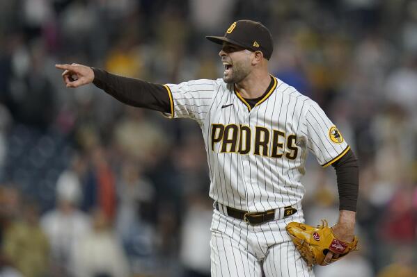 San Diego Padres relief pitcher Nick Martinez, right, celebrates