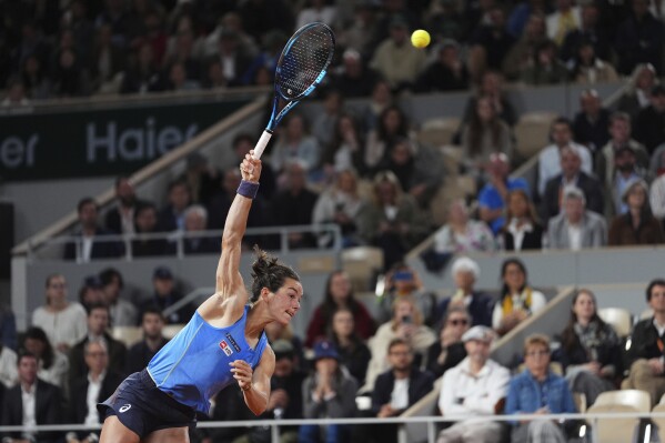 France's Lois Boisson serves against against Coco Gauff of the U.S. during their semifinal match of the French Tennis Open at the Roland-Garros stadium in Paris, Thursday, June 5, 2025. (AP Photo/Lindsey Wasson)